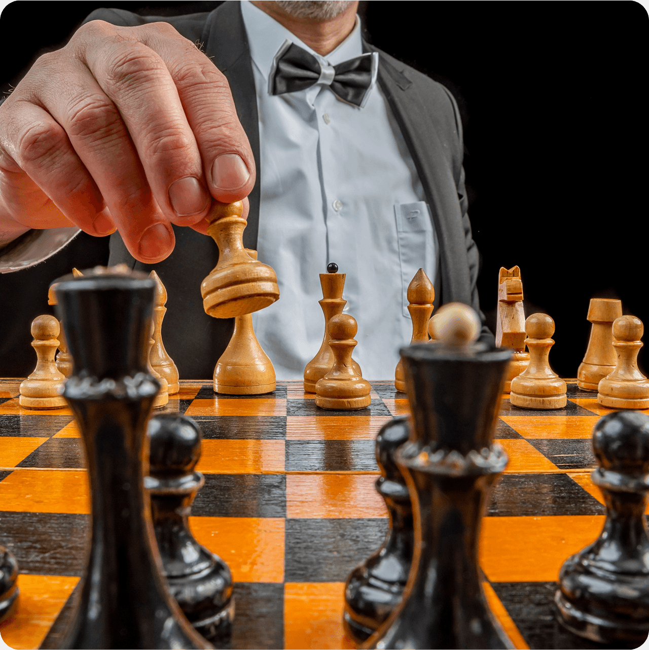 Chess Grandmaster moving pieces on a chessboard